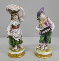 A pair of German Volkstedt porcelain figurines, street sellers/entertainers, 15.5cm