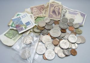 A collection of foreign bank notes and a collection of coins from UK and USA.