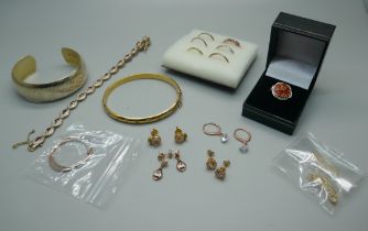 A collection of silver and silver gilt jewellery including two bangles, rings, earrings, etc.