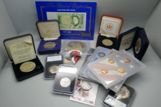 Fifteen commemorative coin sets, medallions and a £1 note, including 50th Anniversary Operation