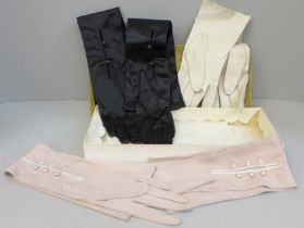 Three pairs of vintage evening gloves, two leather and one silk