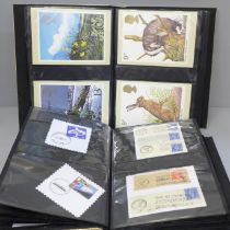 Two albums of stamps and PHQ postcards