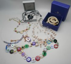 A Lalique pendant, a Swarovski necklace, a silver mounted pendant and necklaces