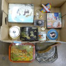 Assorted decorative biscuit tins, a brush and vintage crumb scoop, a metal World Airlines toy plane,