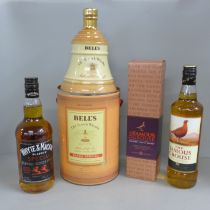 A bottle of Whyte & Mackay Special Blended Scotch Whisky, The Famous Grouse and Bell's Old Scotch