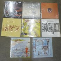 Seven Genesis LP records