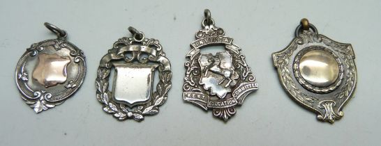 Three silver fob medals including one with gold applied plaque, 21g, and one other fob medal