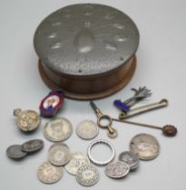 A circular treen box with pewter top and Arts & Crafts peacock detail, a hallmarked silver Royal