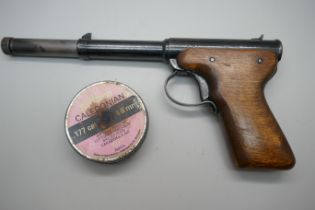 A Diana Model 2, .177 target shooting air pistol, 1953, with a tin of pellets