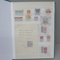 Stamps; a stock book of GB and World Revenue stamps, including entire documents