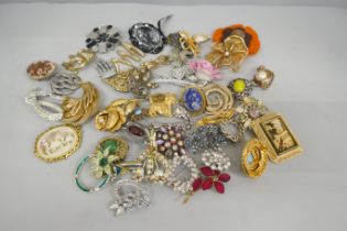 Forty-seven costume brooches