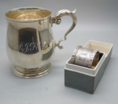A silver mug, Birmingham 1970, 226g, and a boxed silver napkin ring with dragon detail, 39g