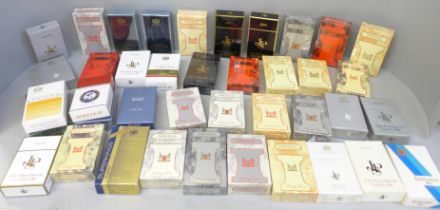 A collection of forty-three sealed and cellophane wrapped dummy cigarette packs from Imperial