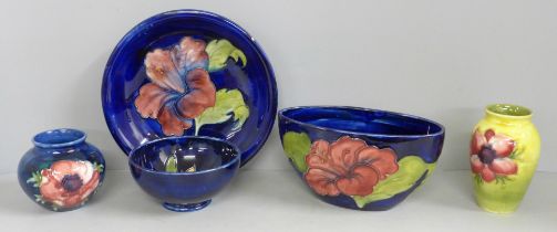 Five items of early 20th Century Moorcroft china, two vases, two bowls and a dish; Hibiscus,