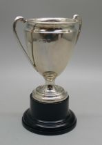 A silver trophy on stand, Elkington, Birmingham 1930, 38g, with inscription