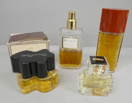 Four perfumes including Yves St. Laurent Opium and Dior Essence by Christian Dior