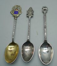 Two silver regimental spoons and a silver and enamel rifle shooting spoon, 48g