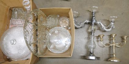 A quantity of cut glass, a butter dish, a decanter, cut glass serving plates and two candelabra **