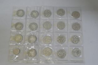 A collection of half silver crowns and other coins