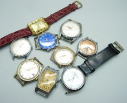 A collection of nine manual wind and quartz wristwatch heads including Roamer, Services, Oris,