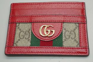 A Gucci leather card holder