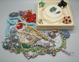 Jewellery; a silver necklace with ten six petal panels, a twig coral necklace, a pair of malachite