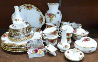 Royal Albert Old Country Roses; six dinner plates, two bread and butter plates, a vase and two