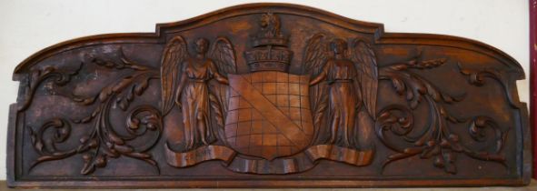 An armorial carved oak plaque