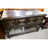 A Jacobean Revival oak geometric moulded two drawer dresser