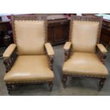 A pair of Victorian Aesthetic Movement carved oak lady's and gentleman's armchairs