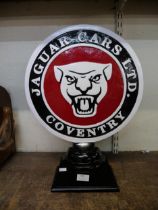 A Jaguar car emblem desk stand