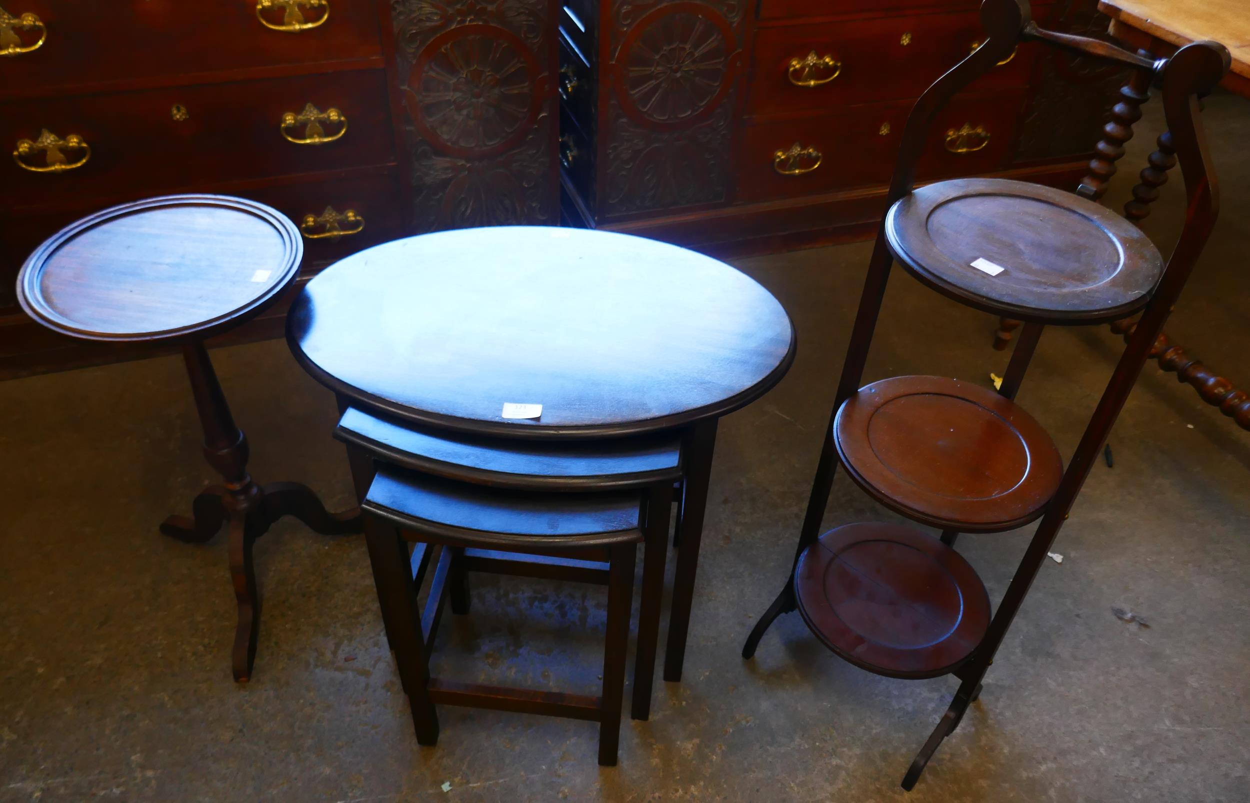 A mahogany nest of tables, a wine table and a folding cake stand