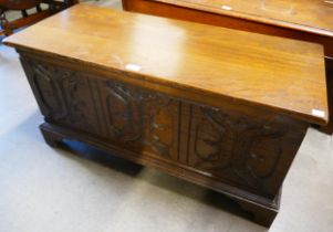 A Jacobean Revival carved oak blanket box