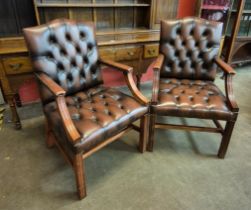 A pair of mahogany and chestnut brown leather Gainsborough style chairs