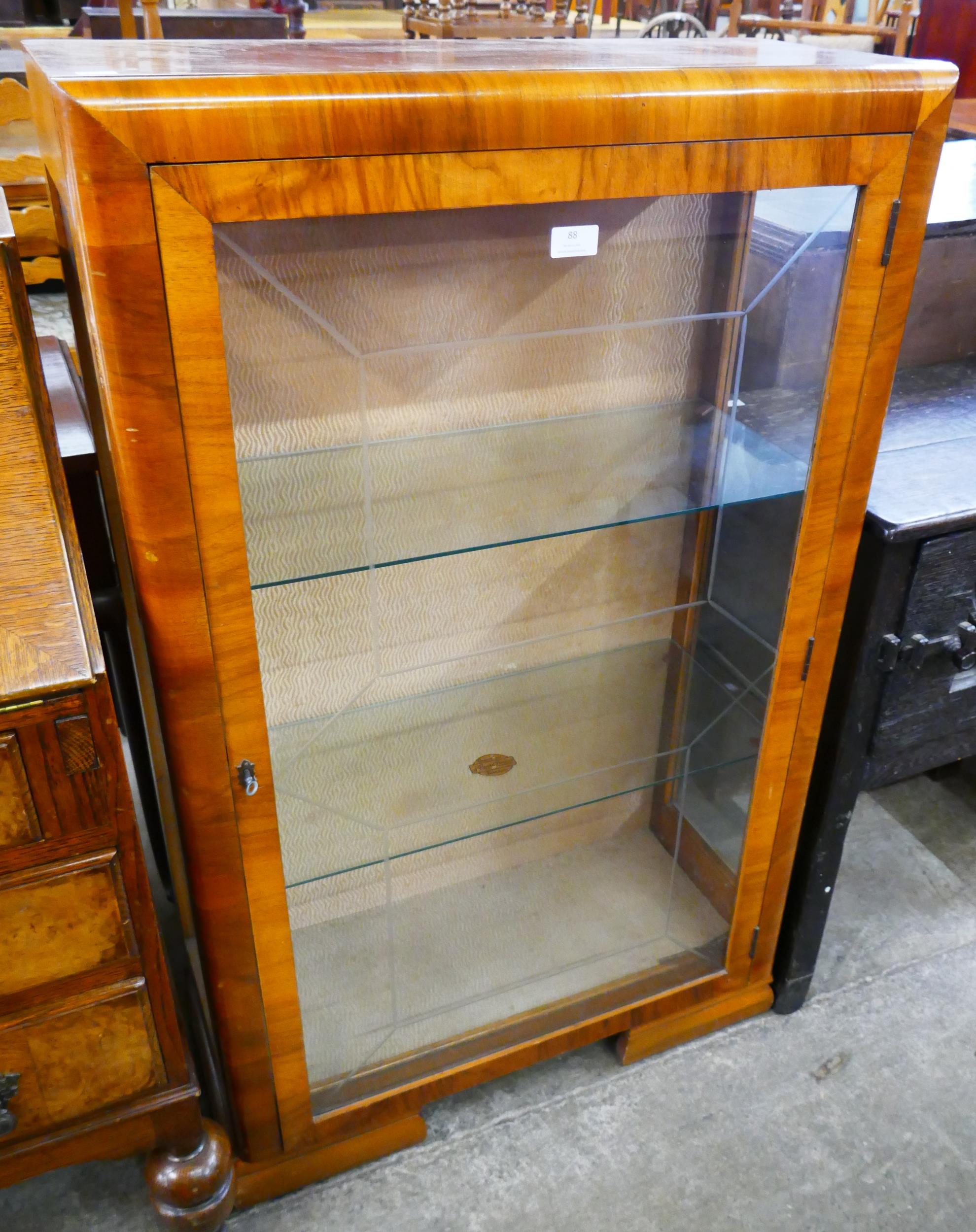 A walnut display cabinet