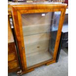 A walnut display cabinet