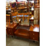 A teak chest of drawers and a dressing table