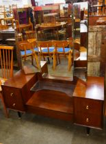 A teak chest of drawers and a dressing table