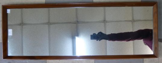 A teak framed mirror