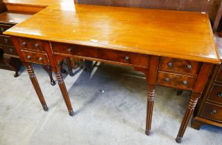 A George IV style mahogany five drawer writing table, manner of Gillows, Lancaster