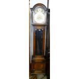 An early 20th Century oak triple weight longcase clock