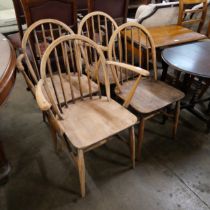 A set of four Ercol elm and beech Windsor chairs