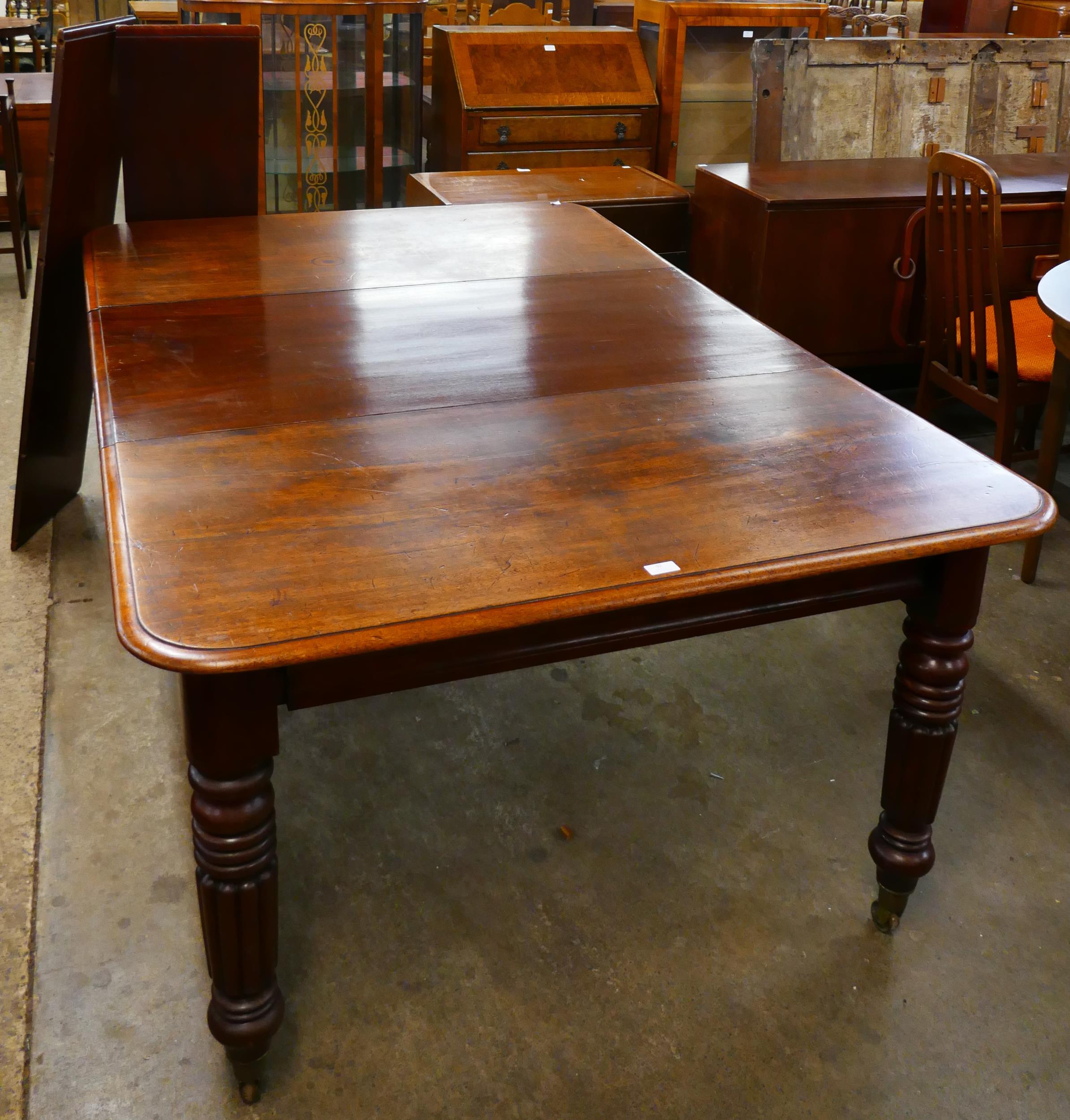 An early Victorian mahogany extending dining table