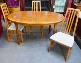 A McIntosh teak extending dining table and three chairs