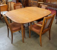 A G-Plan Sierra teak extending dining table and four Fresco dining chairs