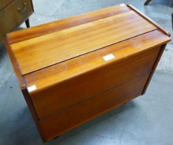 A small teak cocktail cabinet