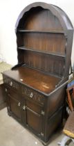 An oak dresser and four assorted chairs