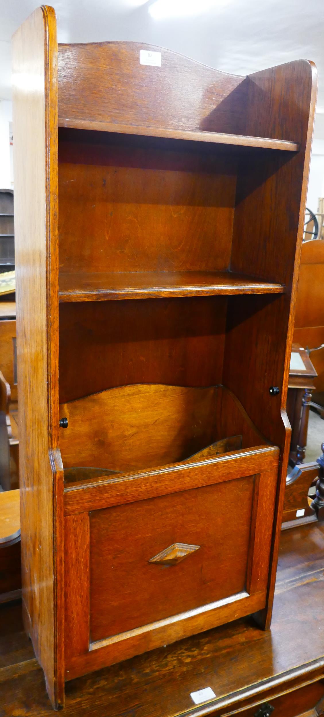 An early 20th Century oak newspaper stand