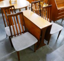 A G-Plan Fresco teak drop-leaf table and four chairs