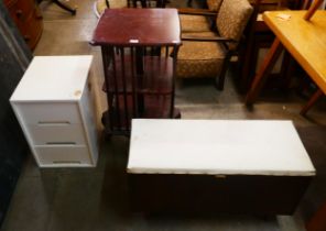 A mahogany revolving bookcase, a blanket box and a painted three drawer chest